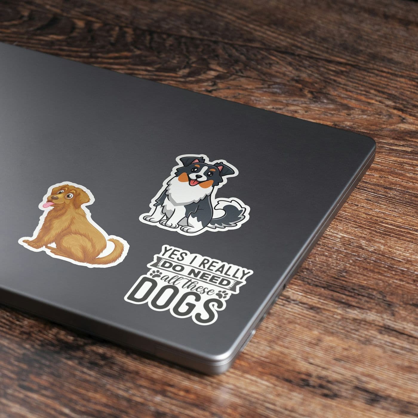 Die cut stickers in different sizes applied to a laptop lid