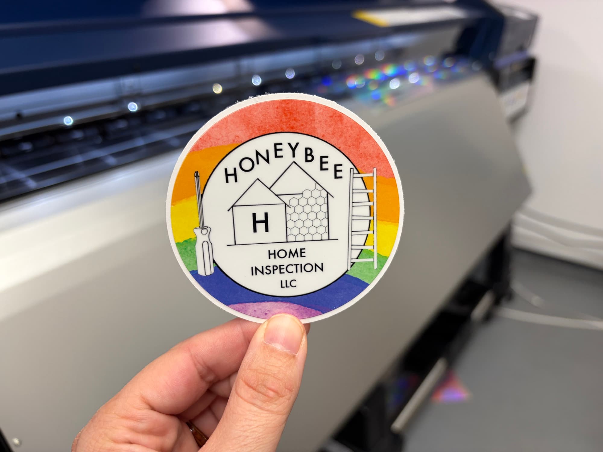 Honeybee Home Inspection circle sticker with a watercolor rainbow border