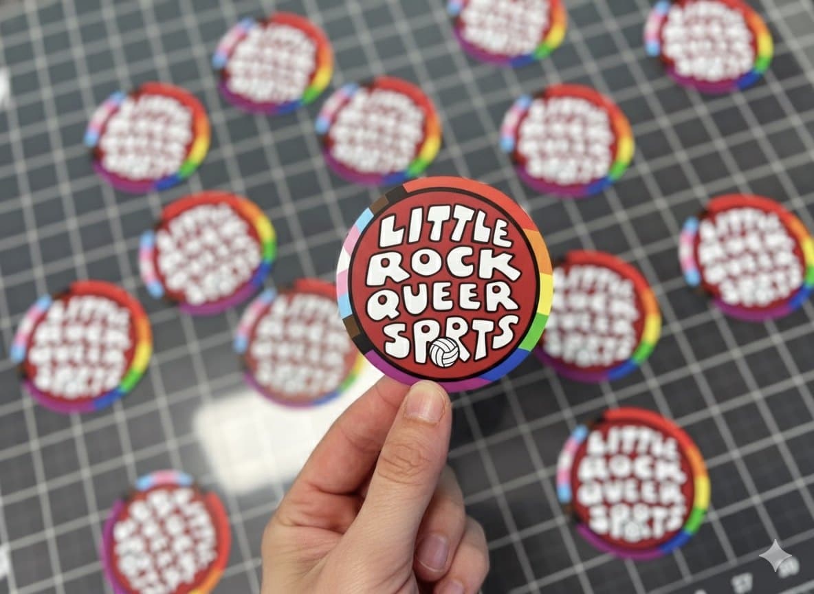 Little Rock Queer Sports circle stickers with a progress flag border