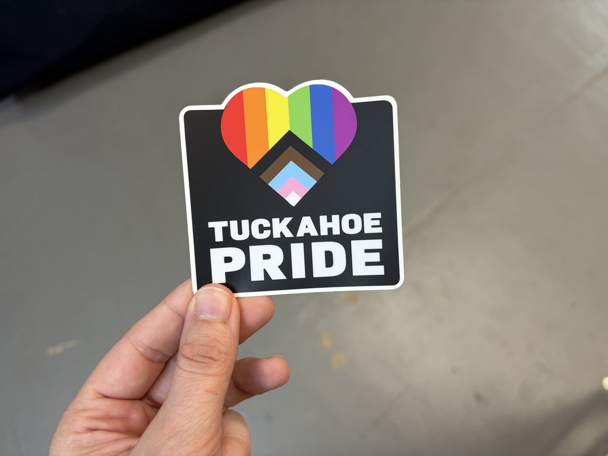 Tuckahoe Pride die cut sticker with a rainbow heart